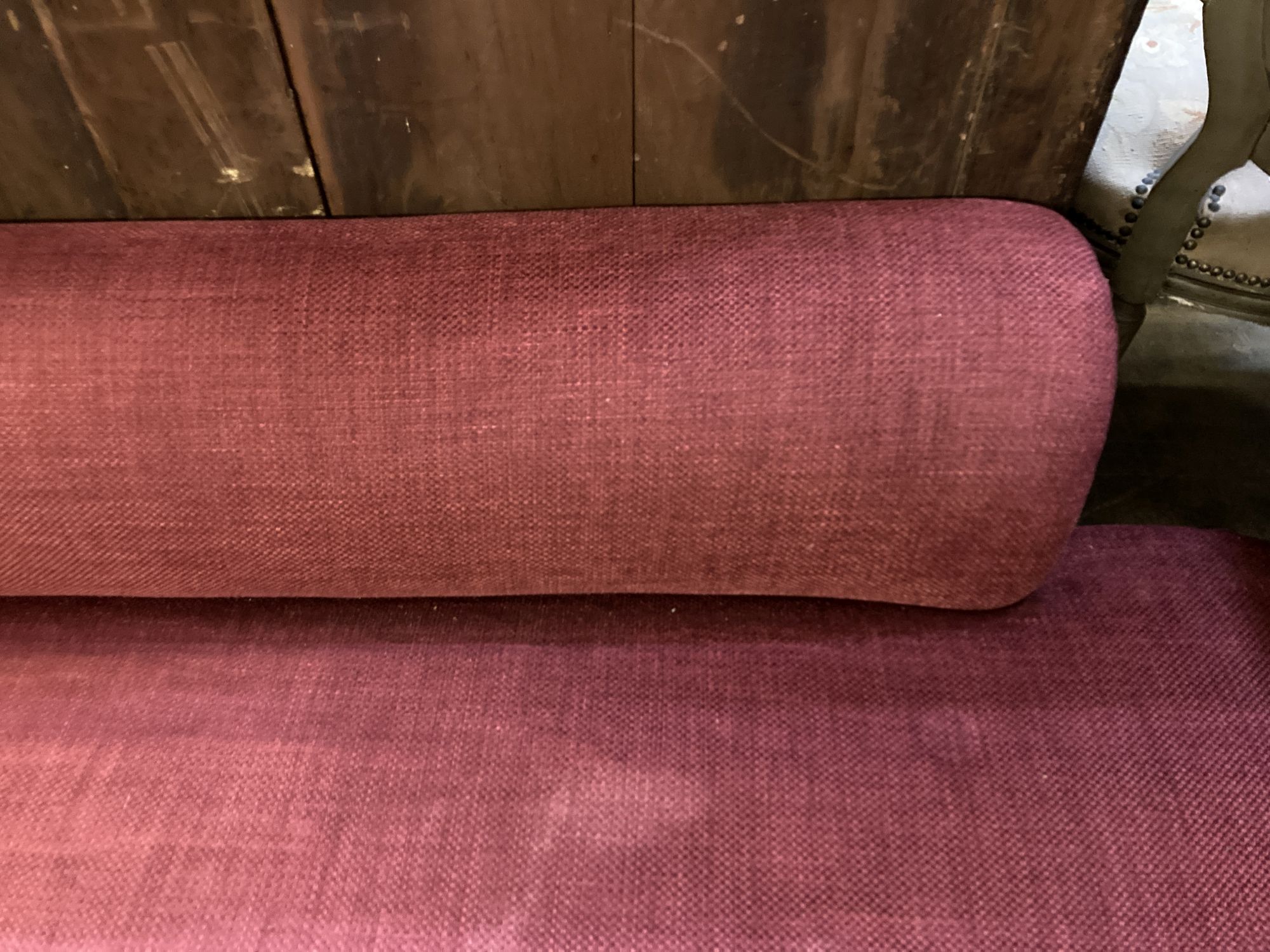 A late Victorian chaise longue, recently upholstered in red fabric, length 168cm, depth 70cm, height 74cm